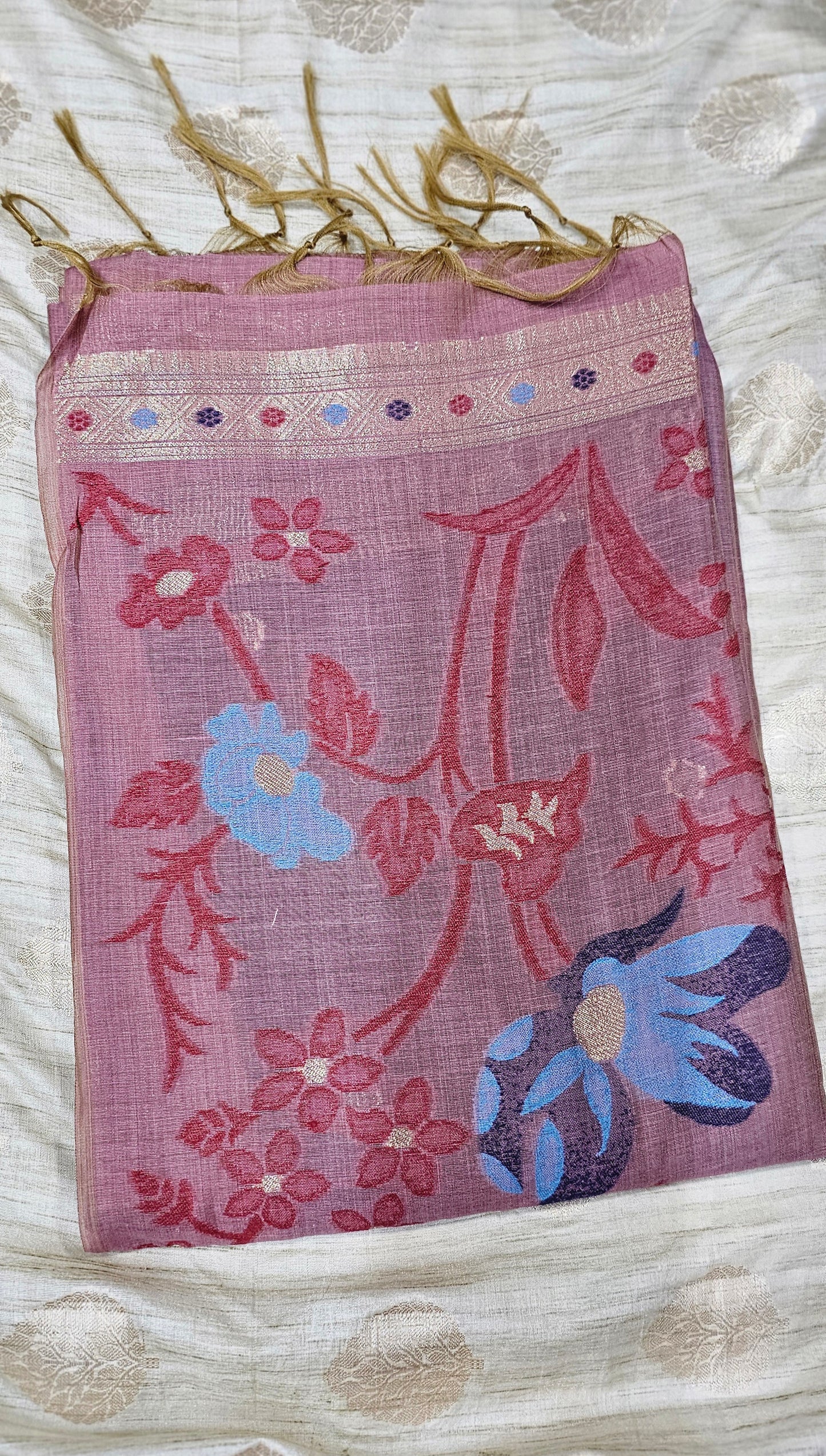 Organic tussar silk saree in muted pink color with intricate floral embroidery
