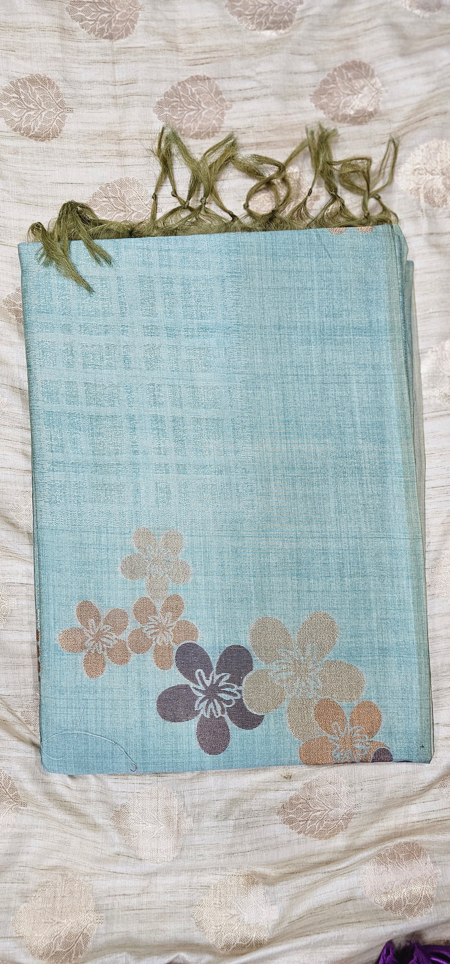 Pure viscose silk saree in pastel turquoise shade with floral weaving .
