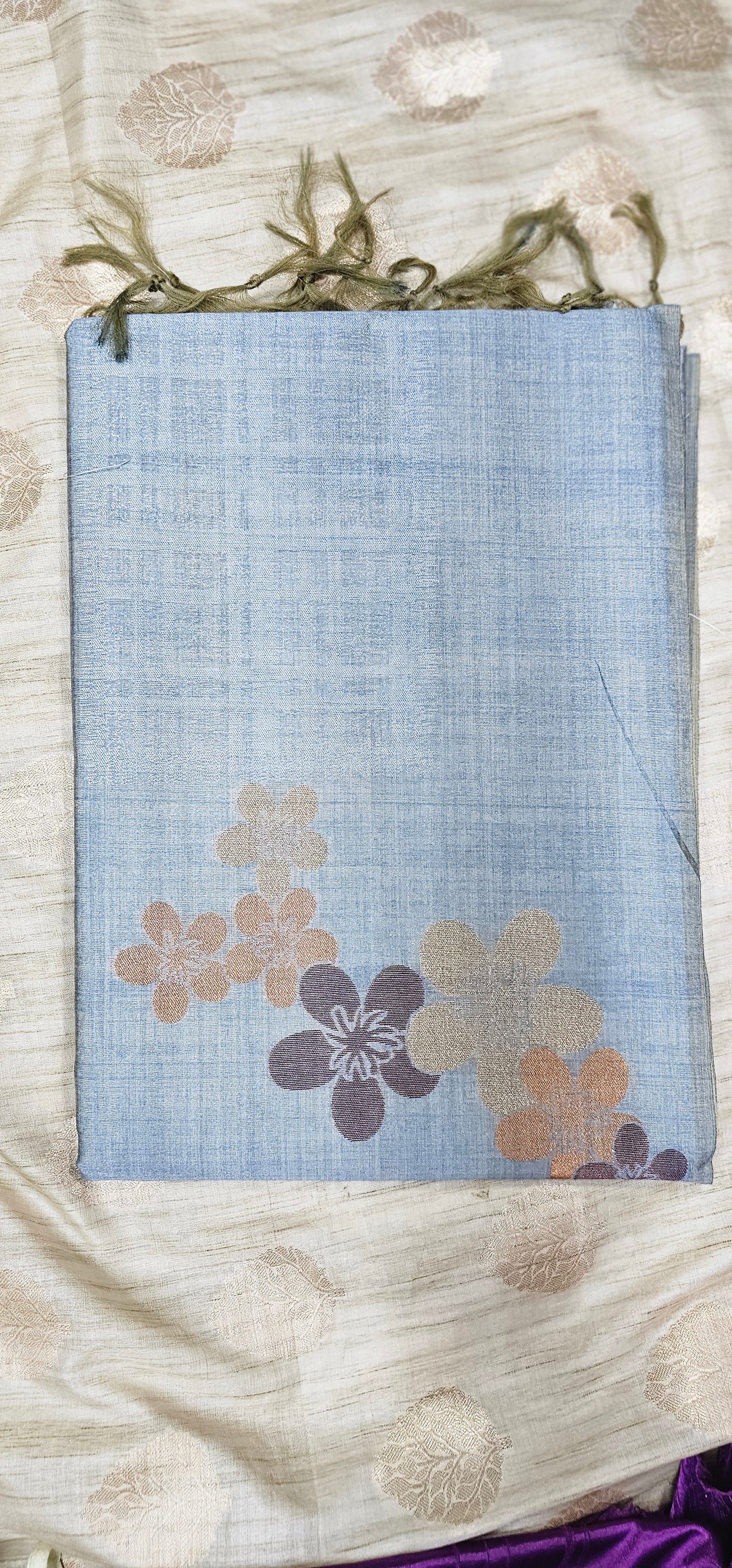 Pure viscose silk saree in serene pastel blue shade with floral weaving .
