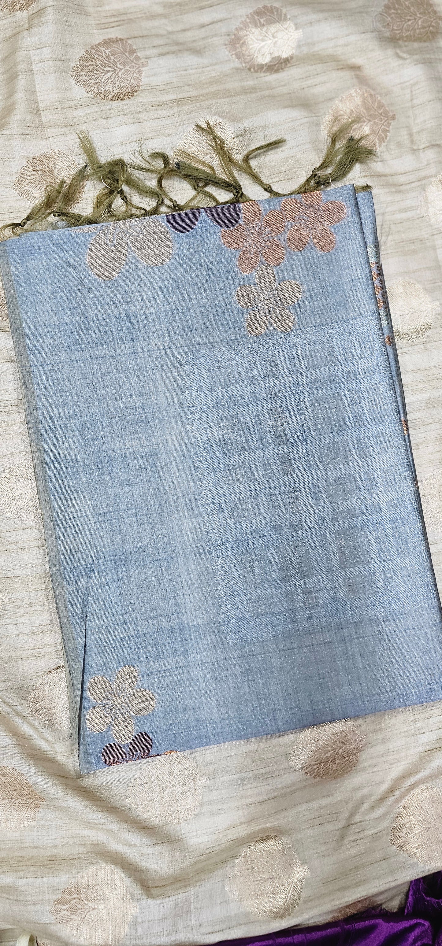 Pure viscose silk saree in serene pastel blue shade with floral weaving .