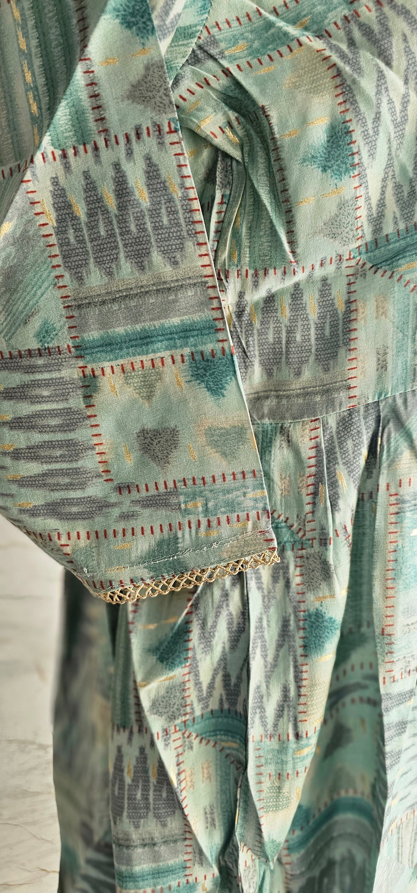 Muslin fabric kurti with zari work on neckline and sleeves
