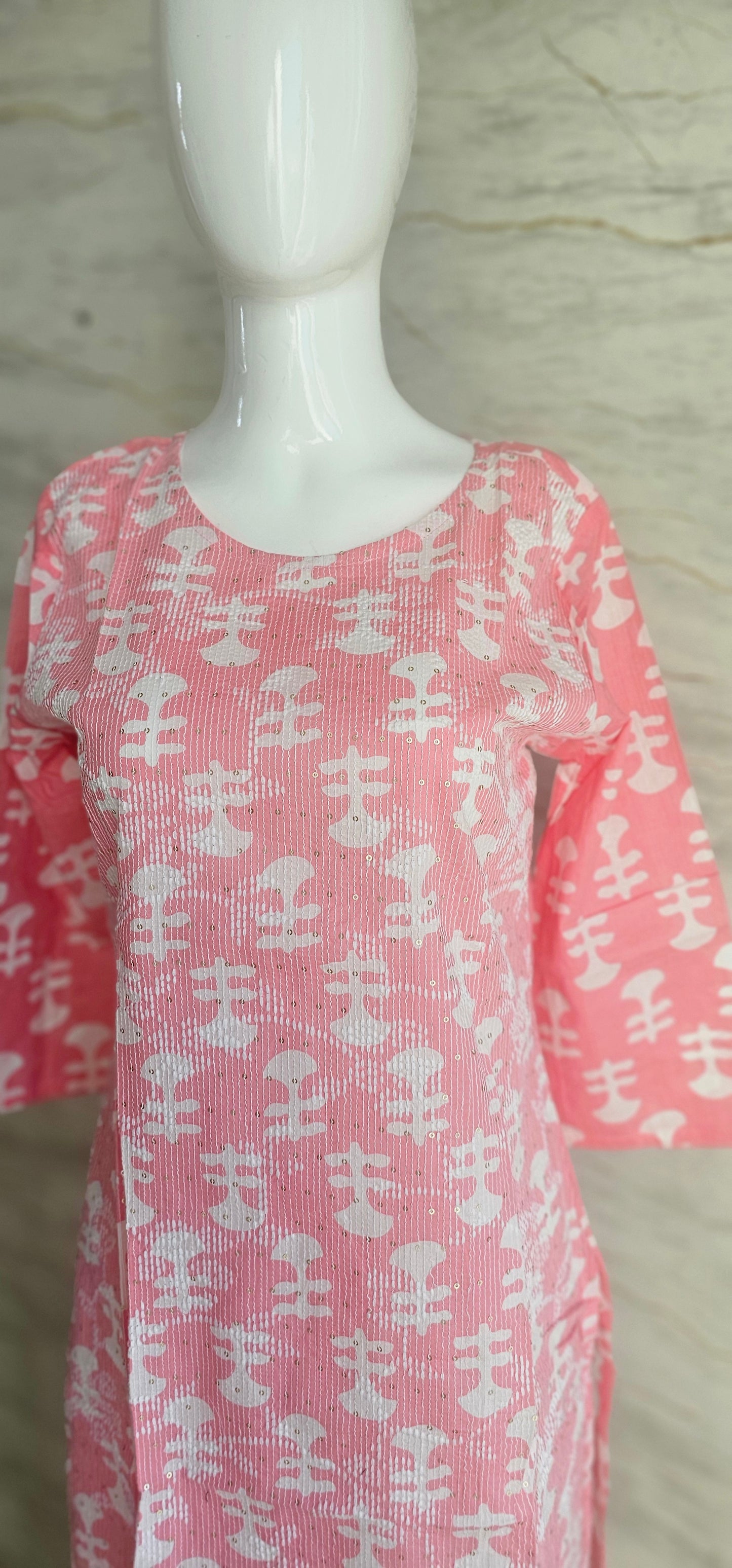 Elegant Cotton fabric kurti with printed motifs and thread work allover.