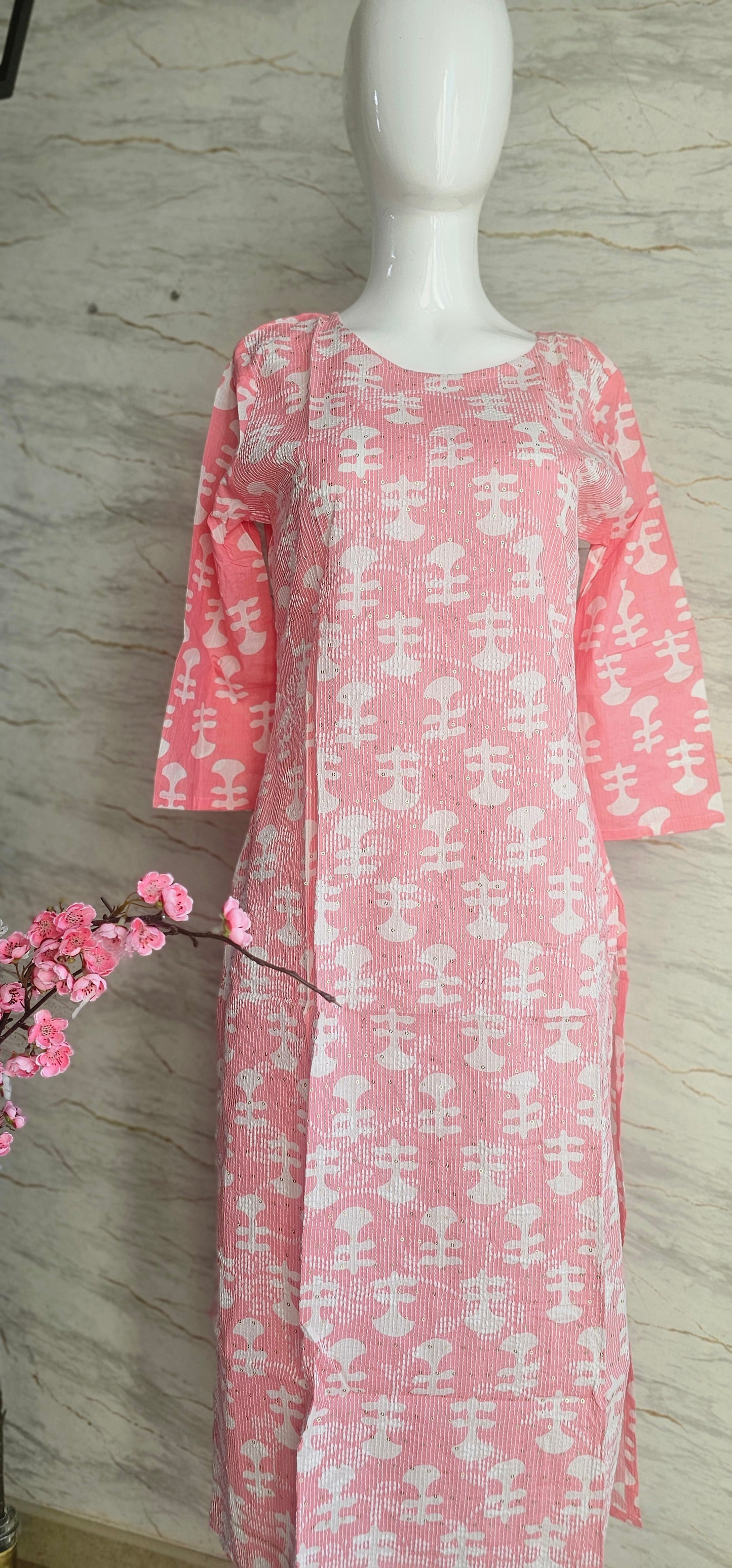 Elegant Cotton fabric kurti with printed motifs and thread work allover.