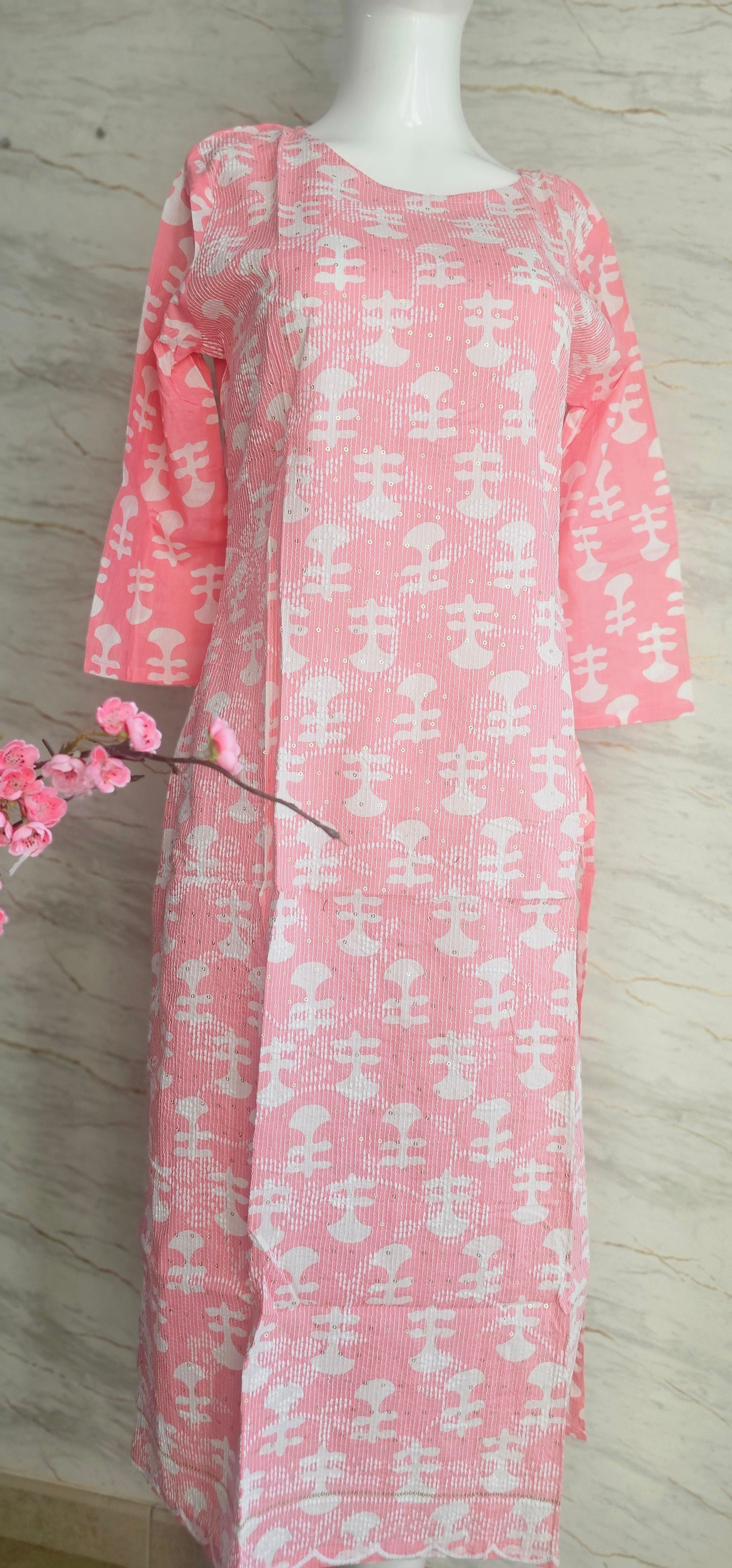 Elegant Cotton fabric kurti with printed motifs and thread work allover.
