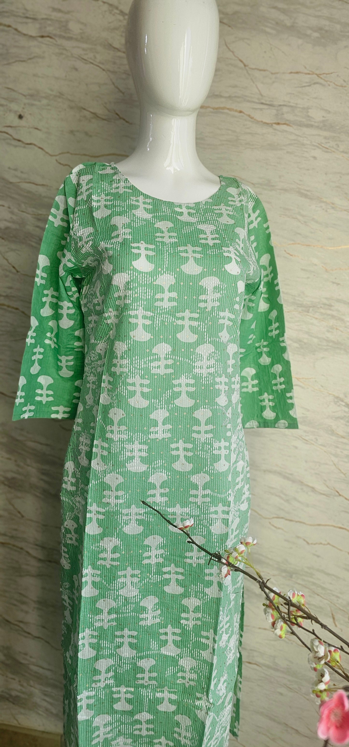 Elegant Cotton fabric kurti with printed motifs and thread work allover.