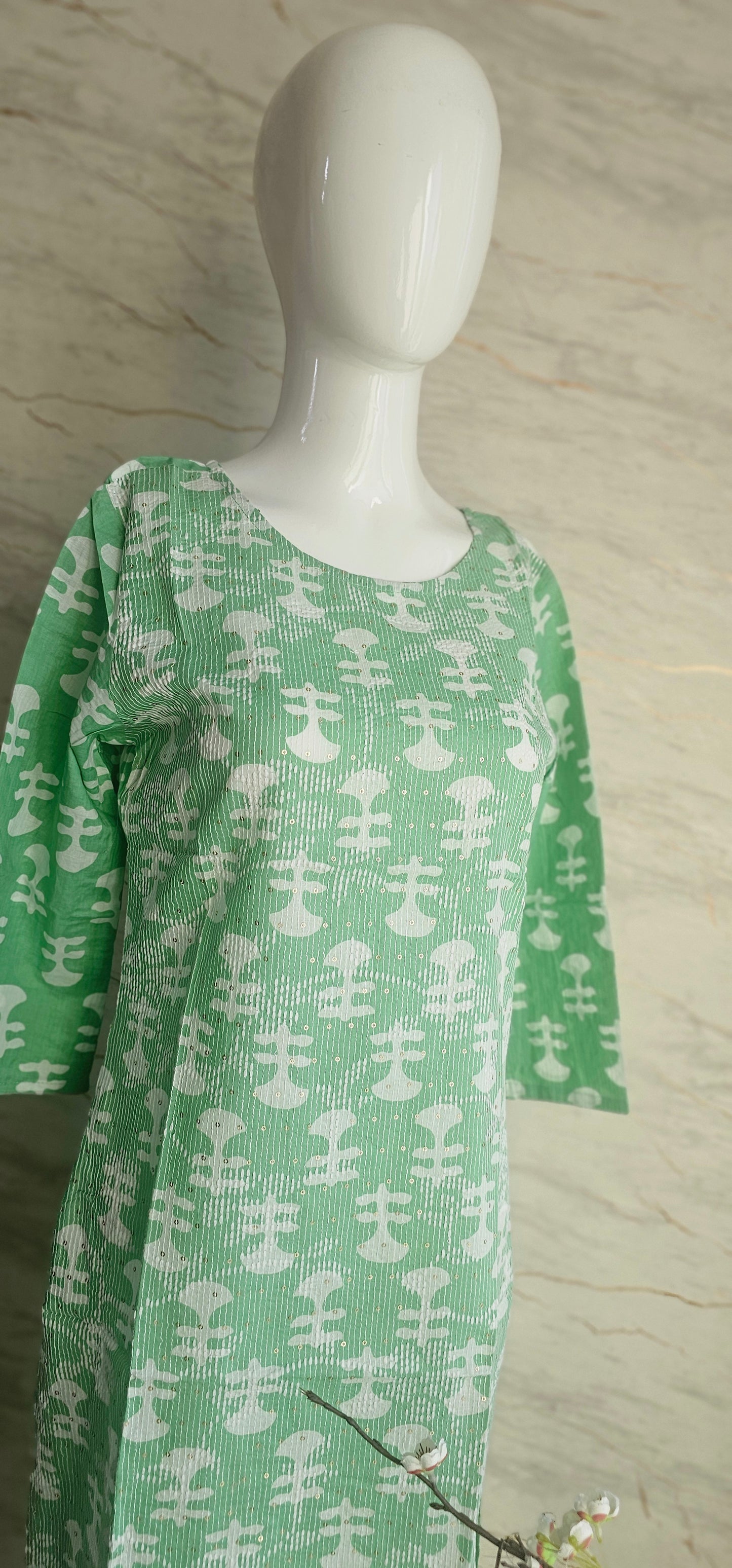 Elegant Cotton fabric kurti with printed motifs and thread work allover.