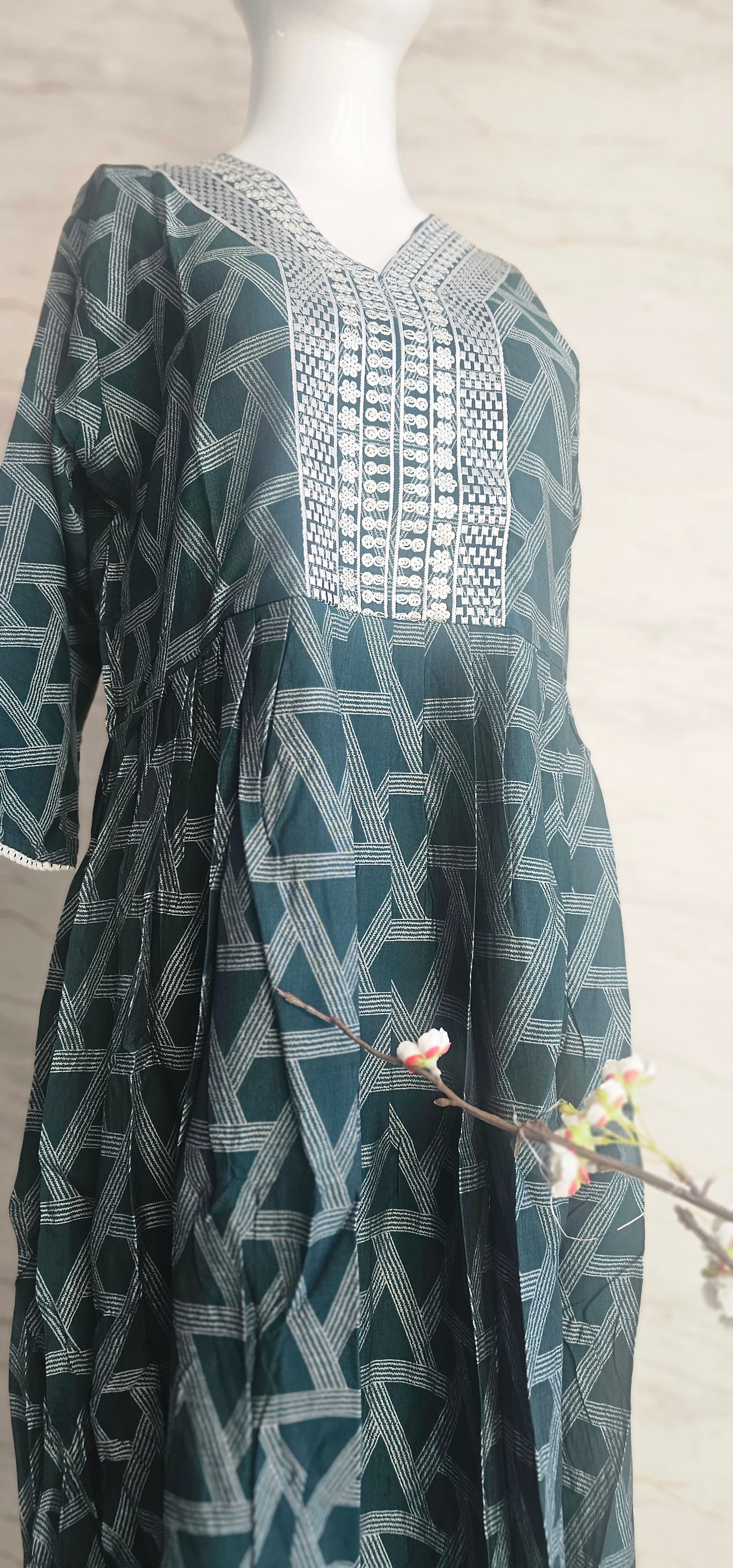 Muslin fabric kurti with emroidered neckline.