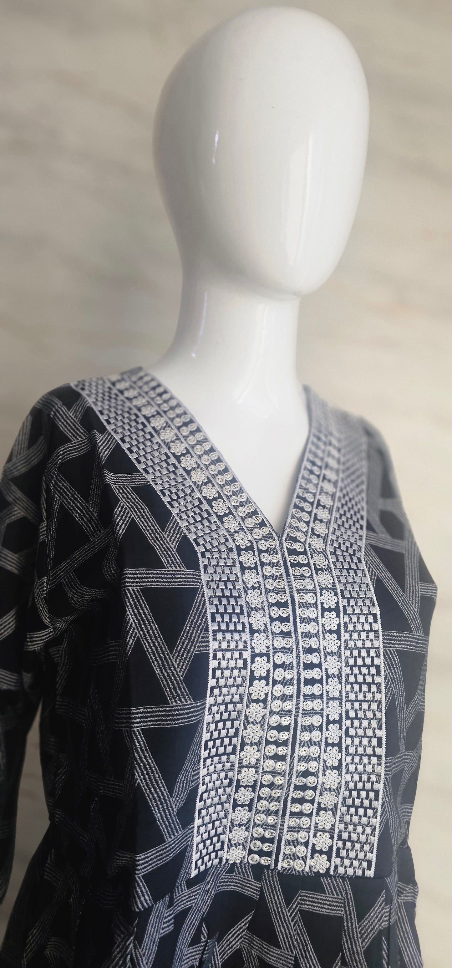 Muslin fabric kurti with emroidered neckline.