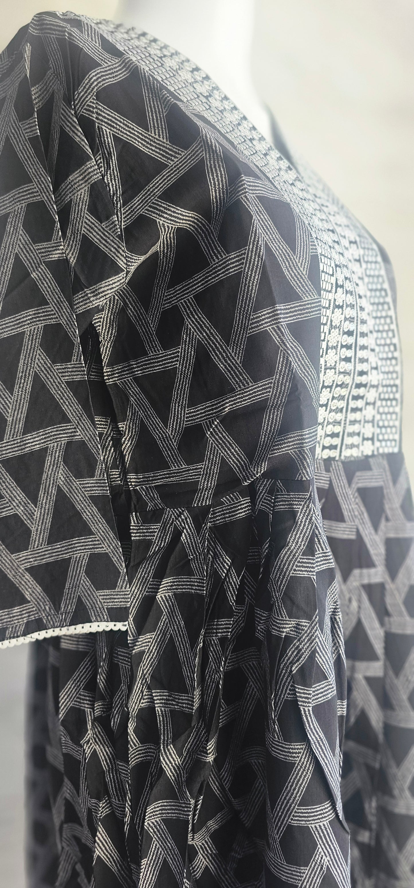 Muslin fabric kurti with emroidered neckline.