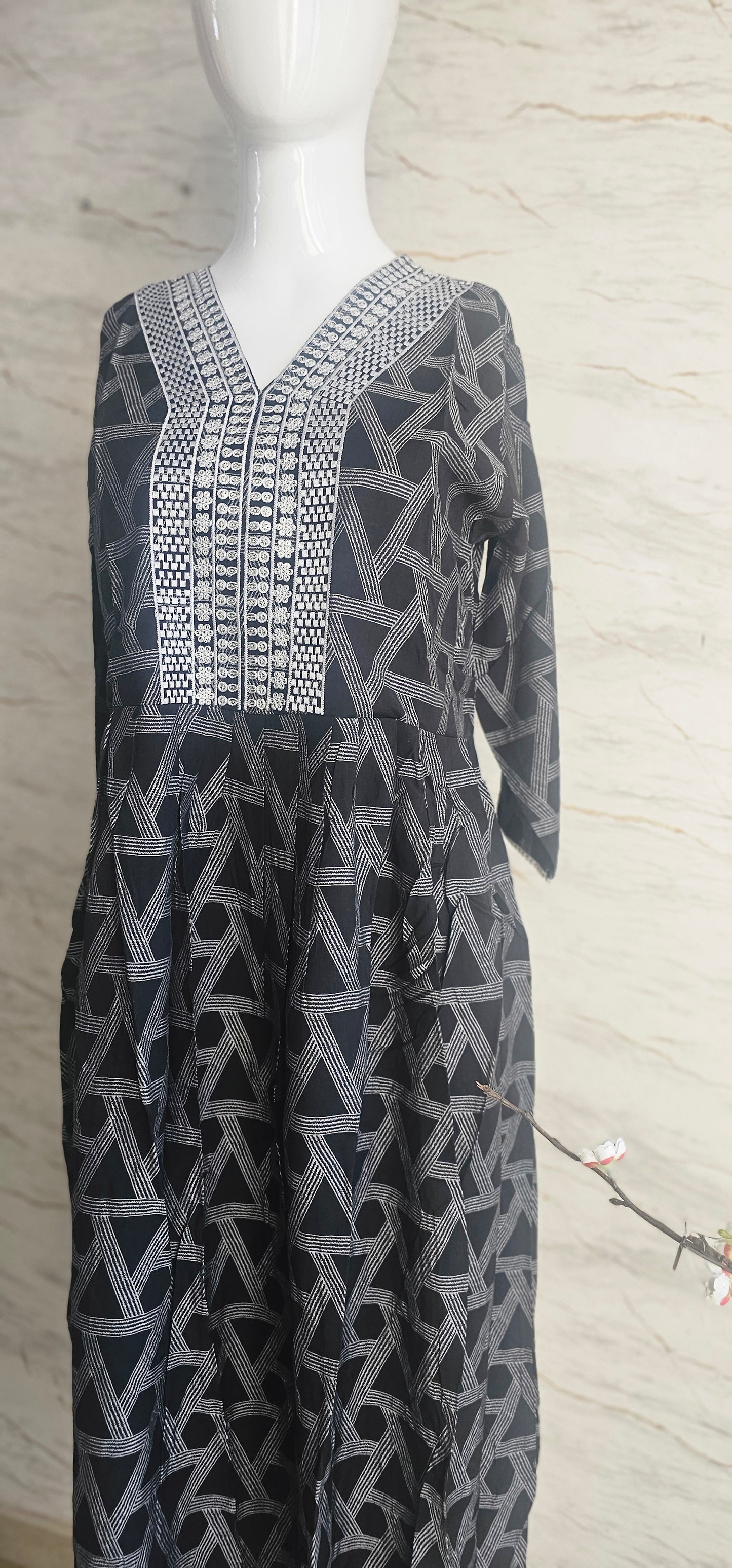Muslin fabric kurti with emroidered neckline.