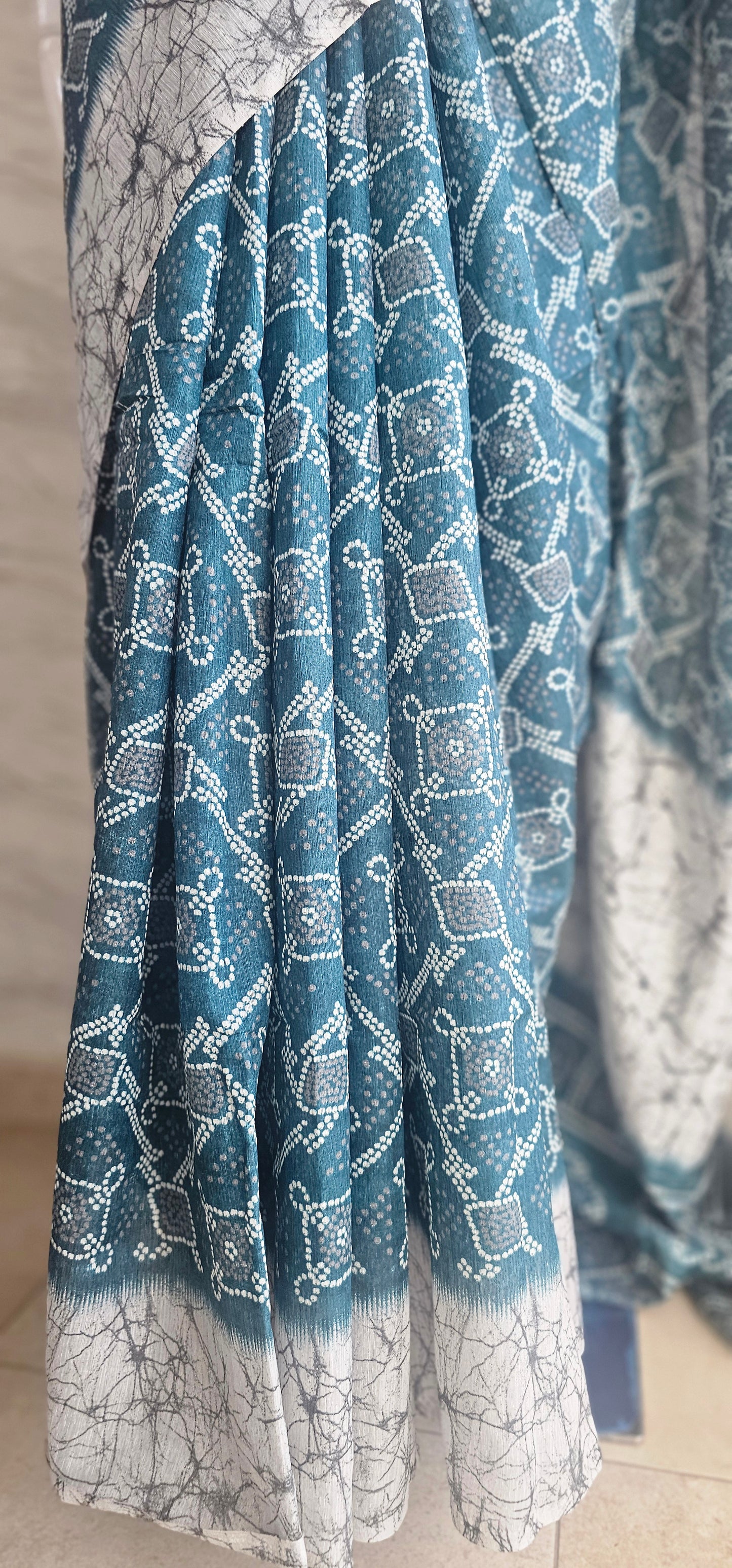 Breezy and beautiful Linen blend sarees with ikat motifs and marble dyestyle pattern in Teal green with a slight blue undertone.