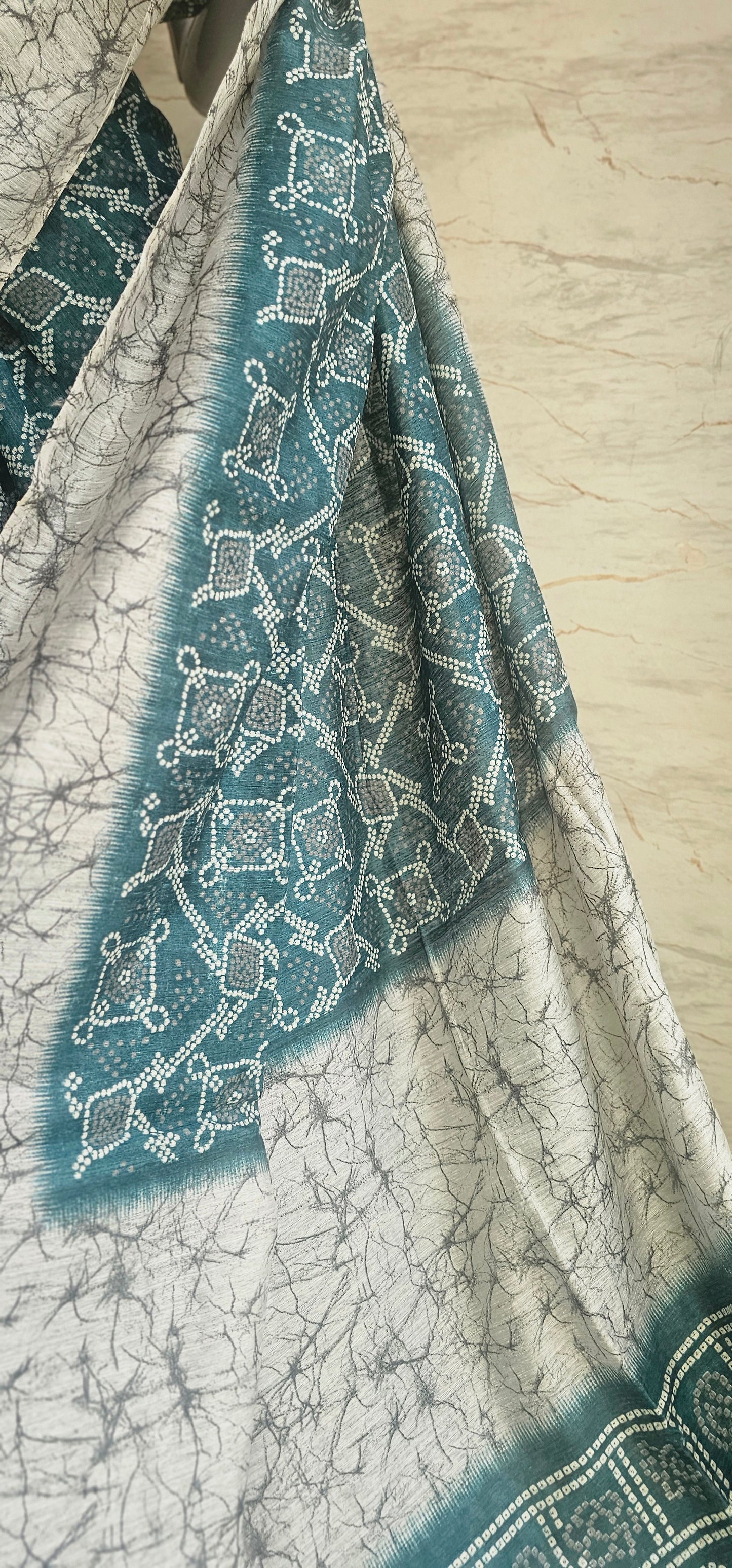 Breezy and beautiful Linen blend sarees with ikat motifs and marble dyestyle pattern in Teal green with a slight blue undertone.