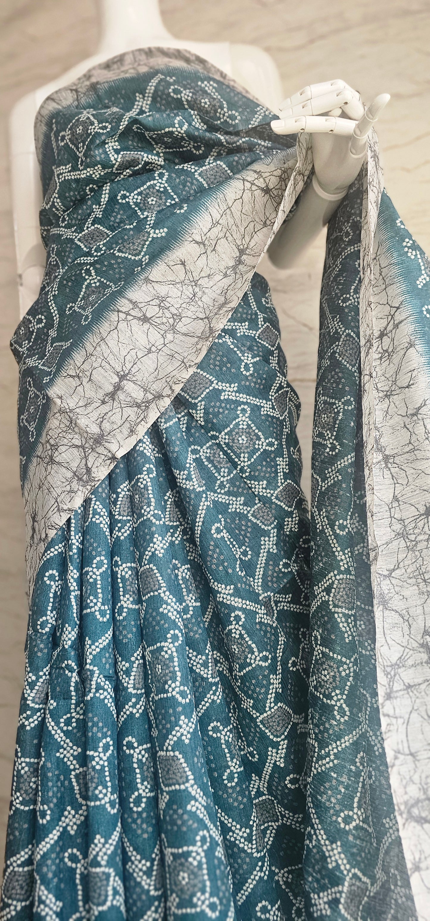 Breezy and beautiful Linen blend sarees with ikat motifs and marble dyestyle pattern in Teal green with a slight blue undertone.