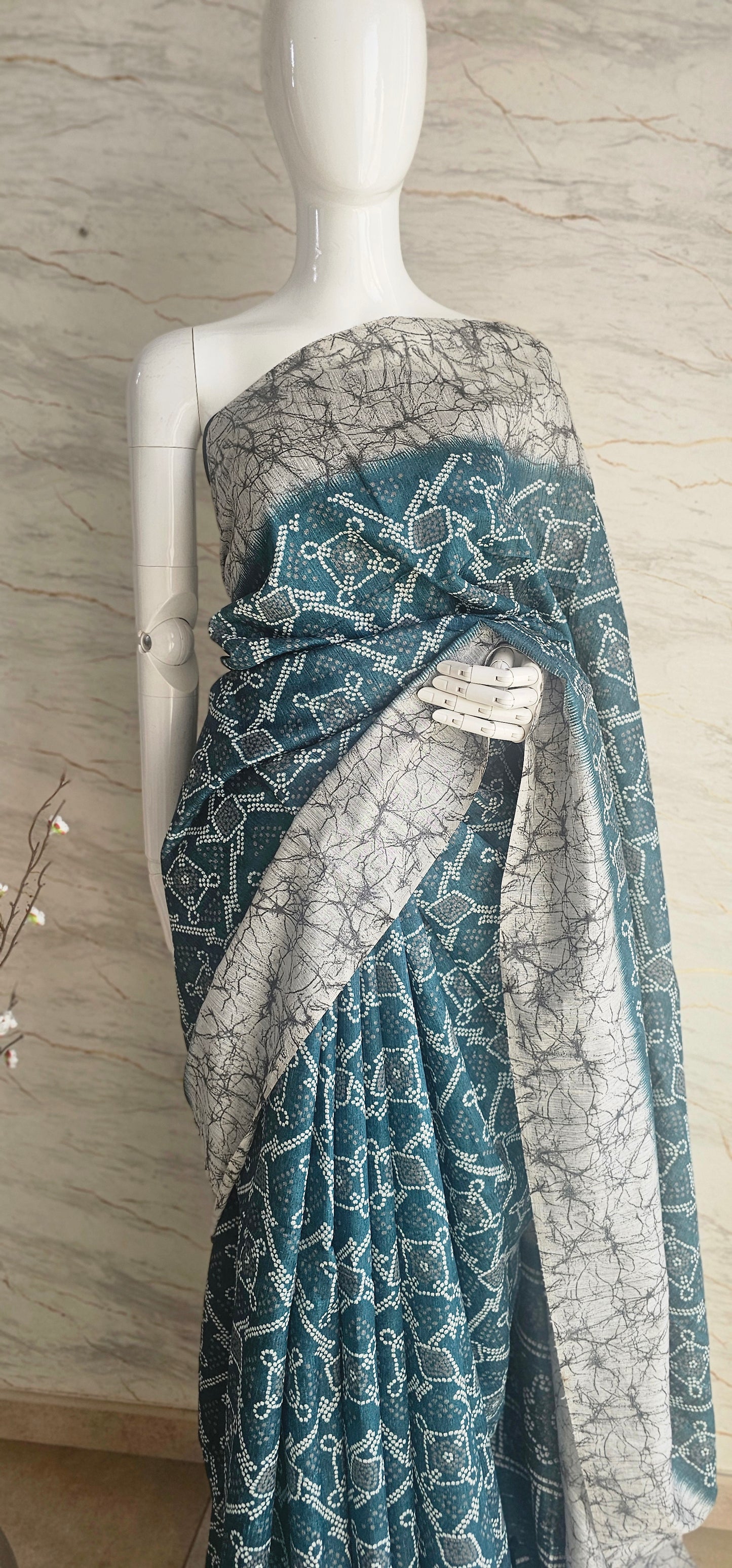 Breezy and beautiful Linen blend sarees with ikat motifs and marble dyestyle pattern in Teal green with a slight blue undertone.