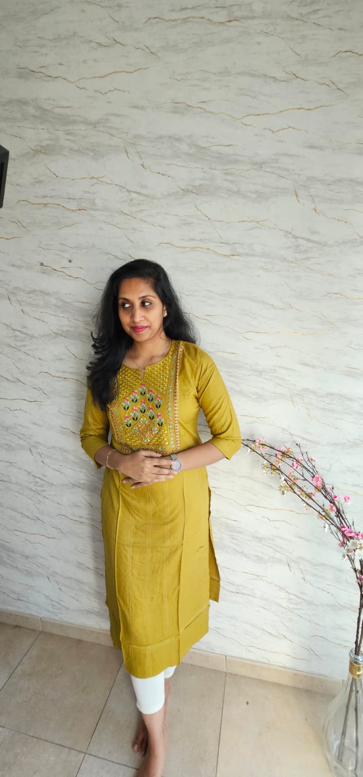 Cotton kurti in mustard yellow shade with a warm undertone.