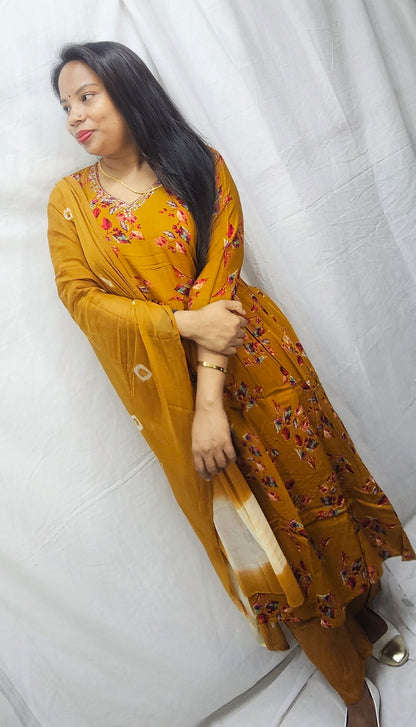 3 pc salwaar suit set in cotton rayon fabric in mustard yellow color.