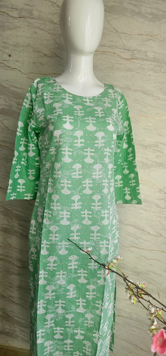 Elegant Cotton fabric kurti with printed motifs and thread work allover.