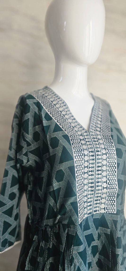 Muslin fabric kurti with emroidered neckline.