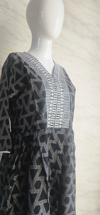 Muslin fabric kurti with emroidered neckline.