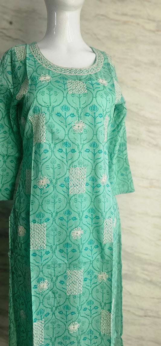 Elegant Cotton fabric kurti with printed motifs and thread work allover