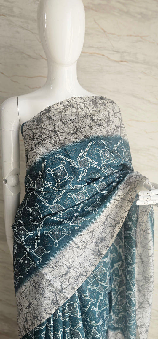 Breezy and beautiful Linen blend sarees with ikat motifs and marble dyestyle pattern in Teal green with a slight blue undertone.